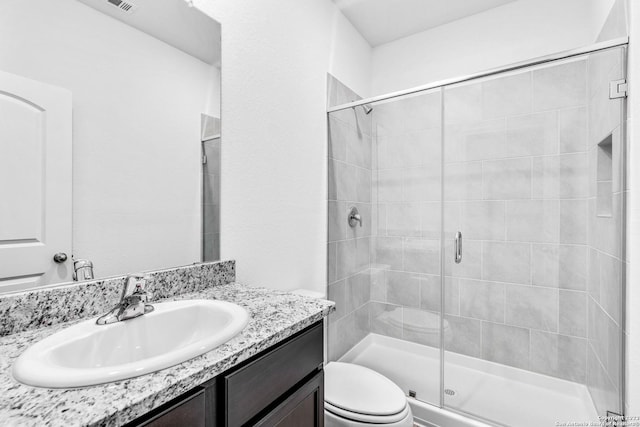 10825 Quinn Ct, San Antonio, TX 78252 - bathroom featuring a shower stall, toilet, and vanity