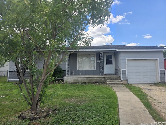 3218 E Southcross, San Antonio, TX 78223 - view of front of property featuring a garage, driveway, a front lawn, and covered porch