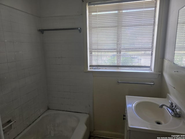 3218 E Southcross, San Antonio, TX 78223 - bathroom with plenty of natural light, vanity, and shower / tub combination