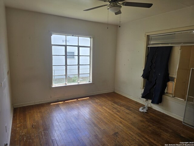 3218 E Southcross, San Antonio, TX 78223 - unfurnished bedroom with multiple windows, wood-type flooring, baseboards, and a closet