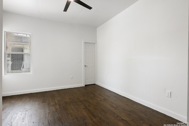 1144 Denver, San Antonio, TX 78210 - unfurnished room featuring a ceiling fan, dark wood finished floors, and baseboards