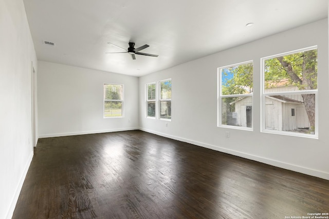1144 Denver, San Antonio, TX 78210 - unfurnished room featuring ceiling fan, dark wood-type flooring, and baseboards