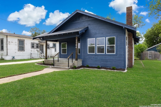 1144 Denver, San Antonio, TX 78210 - bungalow-style home featuring a chimney and a front lawn