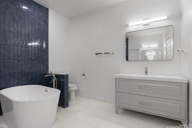 1144 Denver, San Antonio, TX 78210 - bathroom featuring a freestanding tub, vanity, toilet, and tile patterned floors