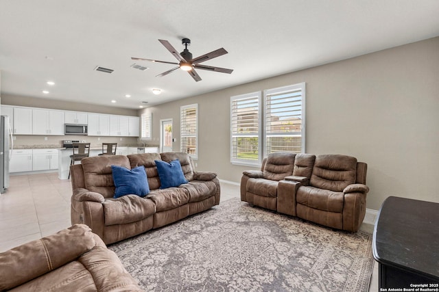 10322 Lady Bird, San Antonio, TX 78252 - living area with a ceiling fan, recessed lighting, light tile patterned flooring, and baseboards