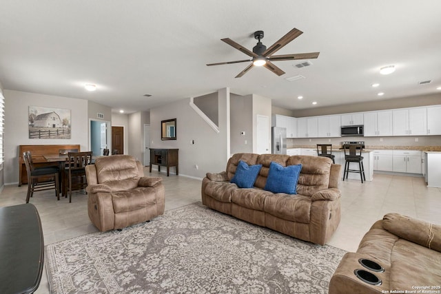 10322 Lady Bird, San Antonio, TX 78252 - living area featuring light tile patterned floors, ceiling fan, baseboards, and recessed lighting