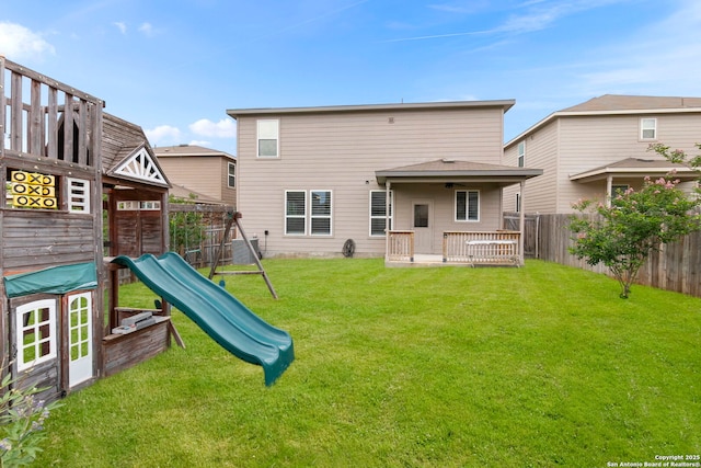10322 Lady Bird, San Antonio, TX 78252 - rear view of house with a playground
