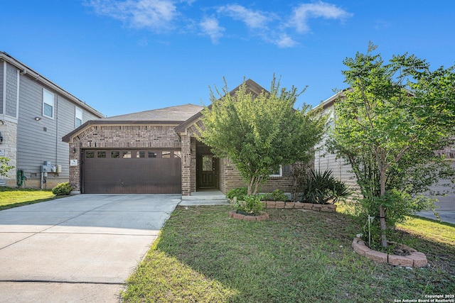 view of front of home with an attached garage, brick siding, driveway, and a front yard