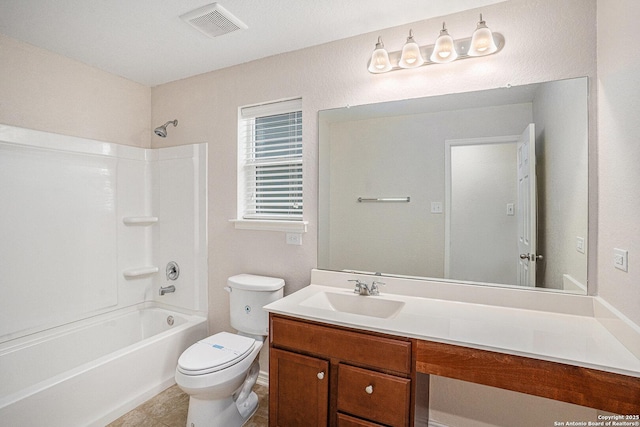 full bathroom featuring toilet, vanity, and tub / shower combination
