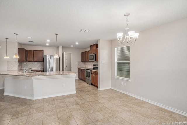 kitchen with appliances with stainless steel finishes, tasteful backsplash, decorative light fixtures, a chandelier, and recessed lighting