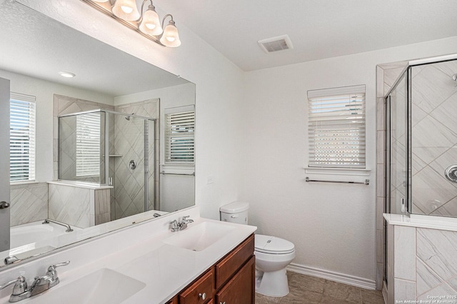 bathroom with a stall shower, plenty of natural light, and toilet