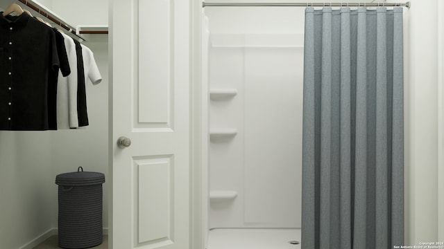 full bathroom featuring a shower stall