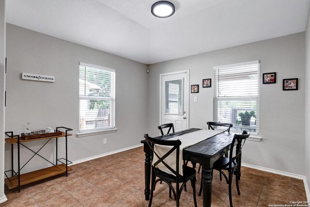 dining area with tile patterned floors and baseboards