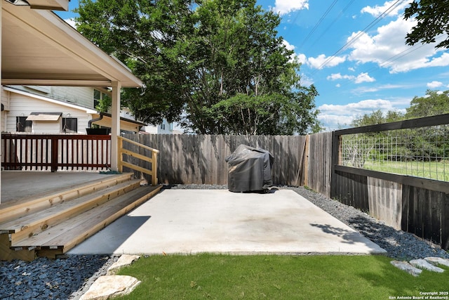 view of patio featuring a fenced backyard and area for grilling