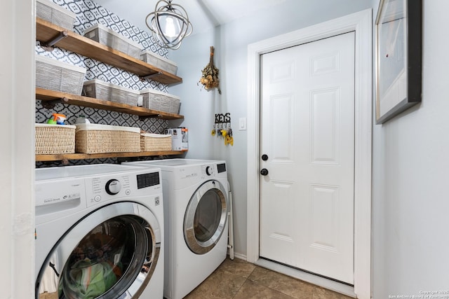 washroom featuring separate washer and dryer and baseboards