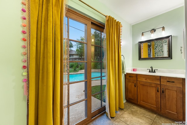bathroom with tile patterned floors and vanity