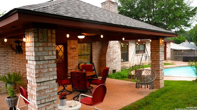 view of patio / terrace featuring fence