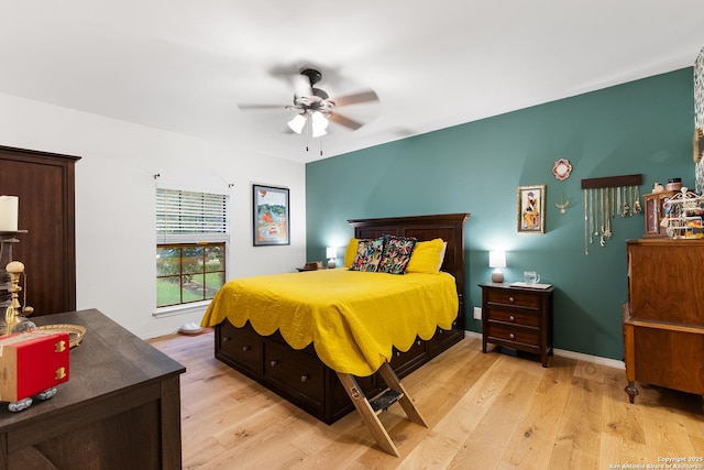 bedroom featuring light wood-type flooring, ceiling fan, and baseboards