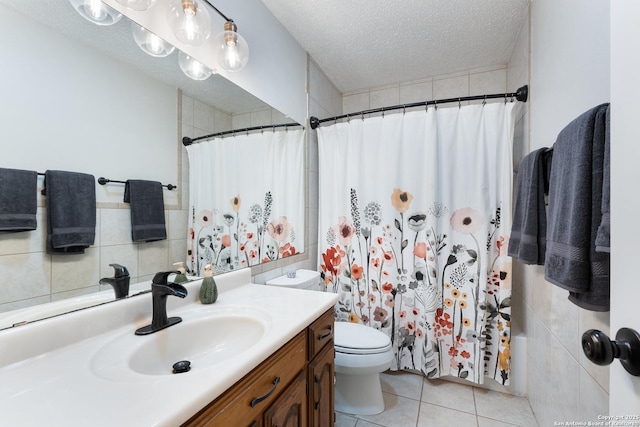 full bath with tile patterned floors, toilet, a textured ceiling, vanity, and a shower with shower curtain