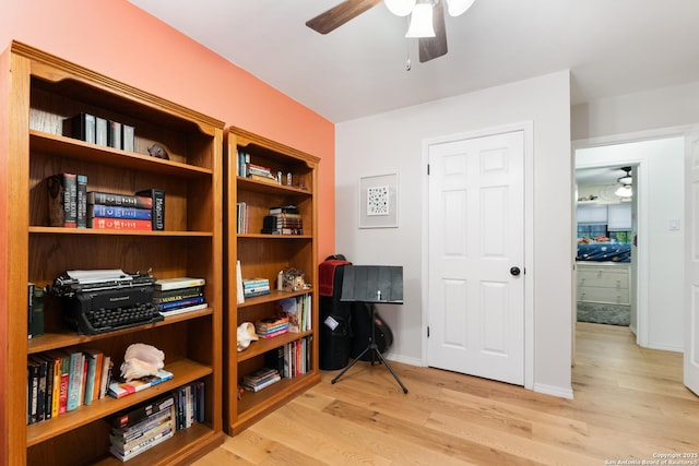 office area with ceiling fan and light wood-style floors