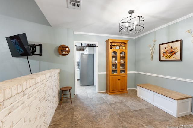 dining room featuring a chandelier, crown molding, and baseboards