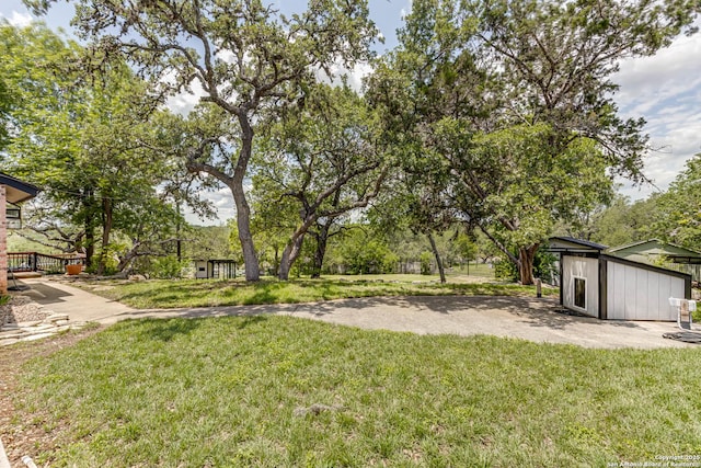 28426 Quadrille Ln, Boerne, TX 78015 - view of grassy yard with an outbuilding