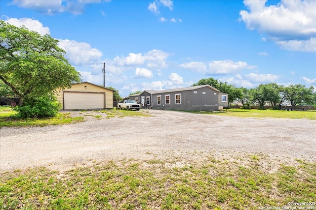 205 Montrose, Liberty Hill, TX 78642 - view of front of property featuring an outbuilding and a detached garage
