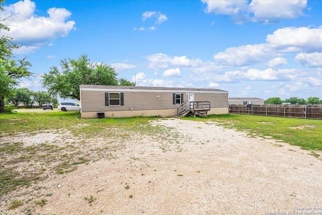 205 Montrose, Liberty Hill, TX 78642 - rear view of house with fence