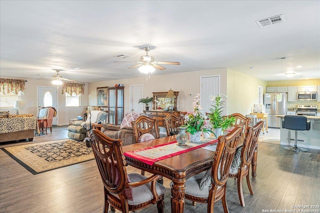 205 Montrose, Liberty Hill, TX 78642 - dining room with ceiling fan, light wood-type flooring, and baseboards