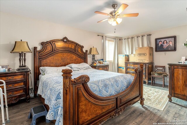 205 Montrose, Liberty Hill, TX 78642 - bedroom with dark wood-style floors and a ceiling fan