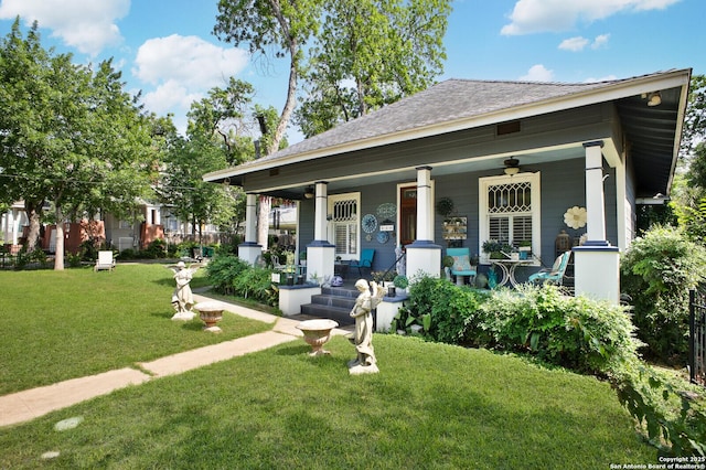 view of front of home featuring covered porch and a front lawn