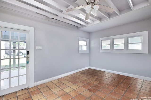 tiled empty room featuring beamed ceiling, a ceiling fan, and baseboards
