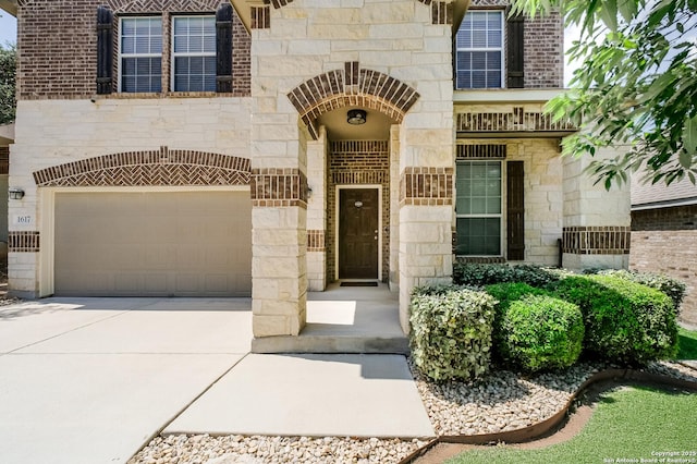 1617 Desert Candle, San Antonio, TX 78245 - entrance to property with stone siding, driveway, and a garage