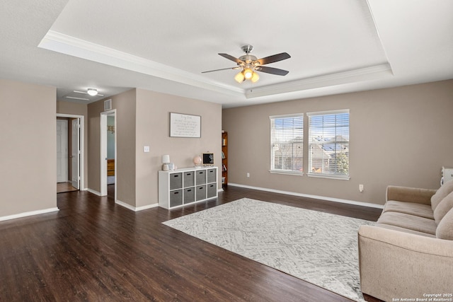 1617 Desert Candle, San Antonio, TX 78245 - living area featuring a raised ceiling, dark wood finished floors, ceiling fan, crown molding, and baseboards