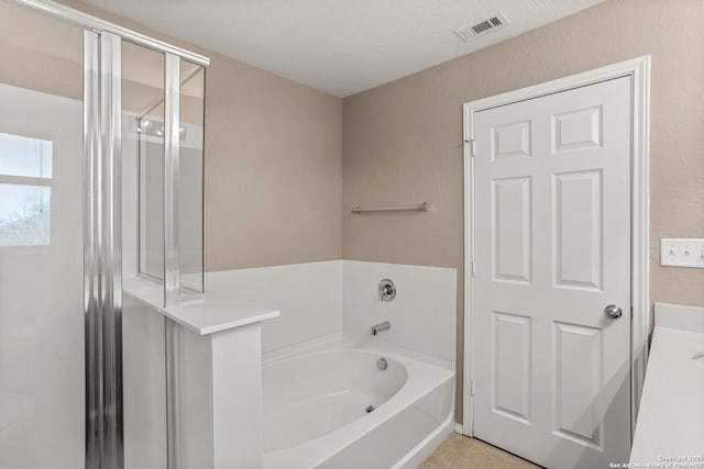 1617 Desert Candle, San Antonio, TX 78245 - bathroom with a bath, a shower stall, and tile patterned floors