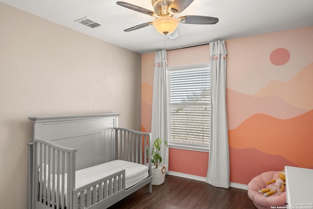 1617 Desert Candle, San Antonio, TX 78245 - bedroom featuring baseboards, wood finished floors, a ceiling fan, and a crib