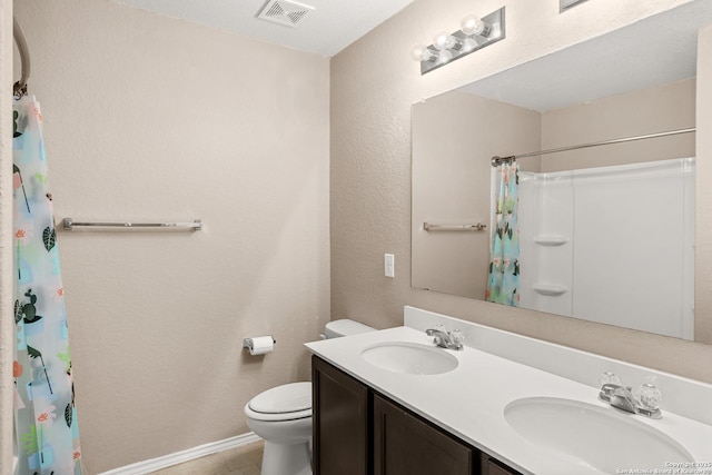 1617 Desert Candle, San Antonio, TX 78245 - full bathroom featuring toilet, curtained shower, double vanity, and baseboards