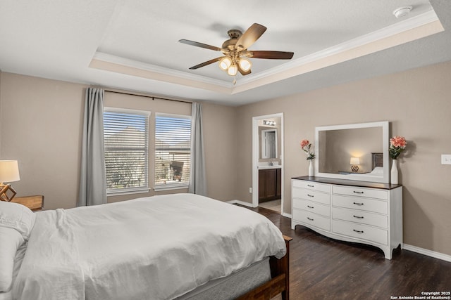 1617 Desert Candle, San Antonio, TX 78245 - bedroom featuring a tray ceiling, ornamental molding, dark wood finished floors, baseboards, and connected bathroom