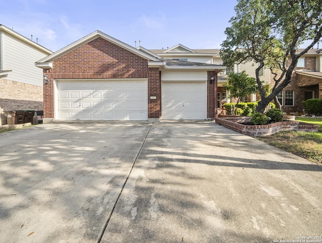 11834 William Carey, San Antonio, TX 78253 - view of front of home featuring brick siding, concrete driveway, and a garage