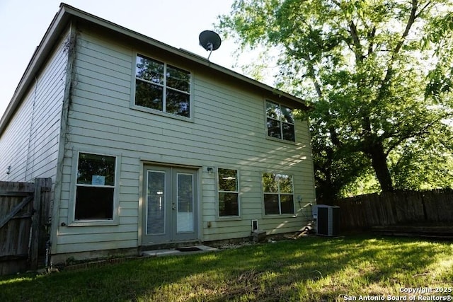 back of property with french doors and cooling unit