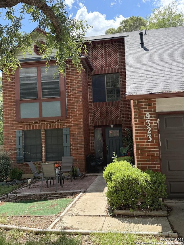 9323 Andersonville, San Antonio, TX 78240 - view of front of property with brick siding and a patio area
