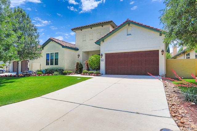 mediterranean / spanish-style home featuring stucco siding, a garage, driveway, and a tile roof