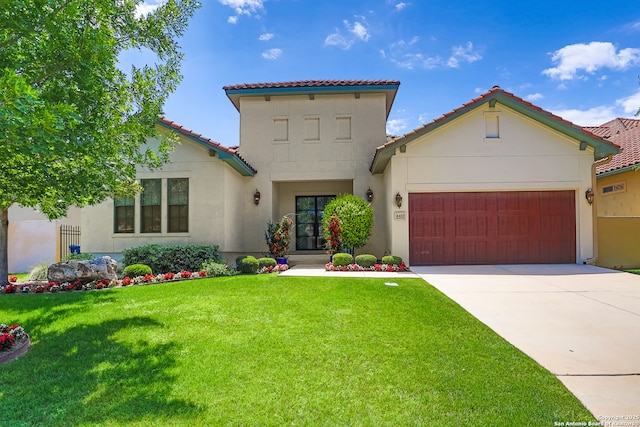 mediterranean / spanish-style house featuring stucco siding, a garage, a tile roof, and driveway