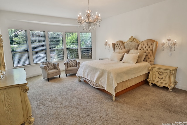 bedroom with carpet flooring, a chandelier, multiple windows, and baseboards