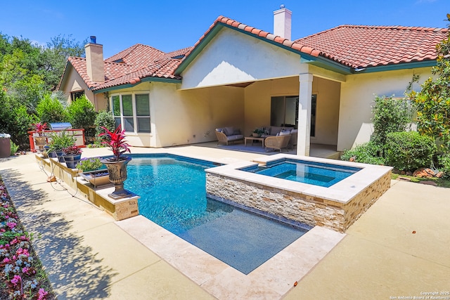 back of property with a chimney, stucco siding, outdoor lounge area, and a patio area