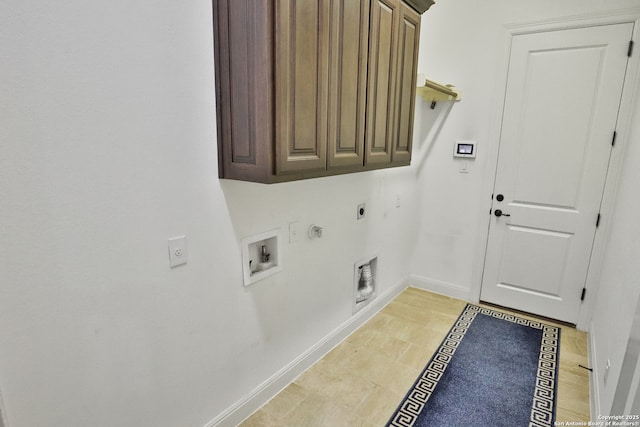 washroom with hookup for an electric dryer, cabinet space, gas dryer hookup, washer hookup, and baseboards