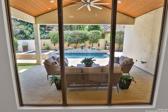 view of patio with a ceiling fan, a fenced backyard, outdoor lounge area, and a pool with connected hot tub