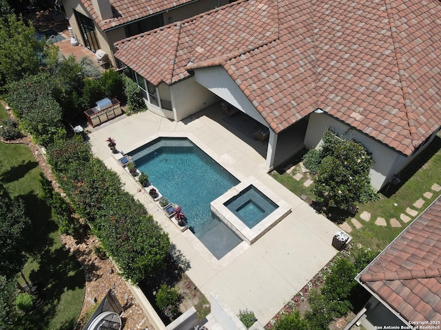 view from above of property with a pool area