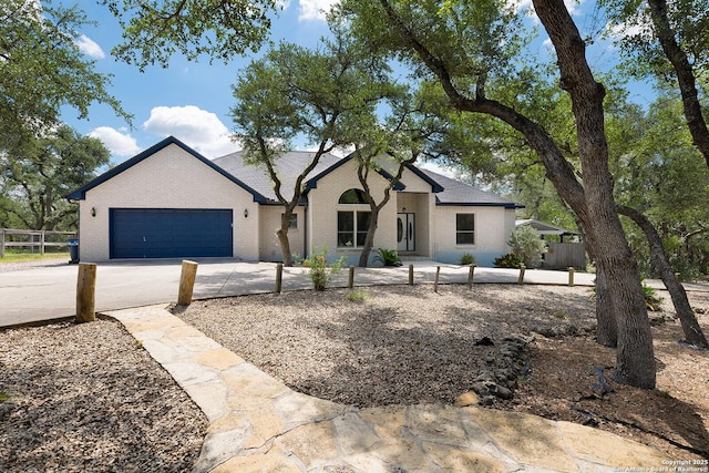 552 Mountain Oaks, Canyon Lake, TX 78133 - view of front facade with driveway, a garage, fence, and brick siding