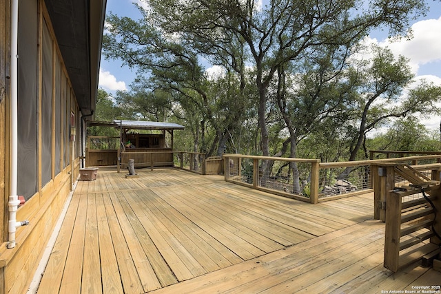 552 Mountain Oaks, Canyon Lake, TX 78133 - wooden terrace with view of wooded area